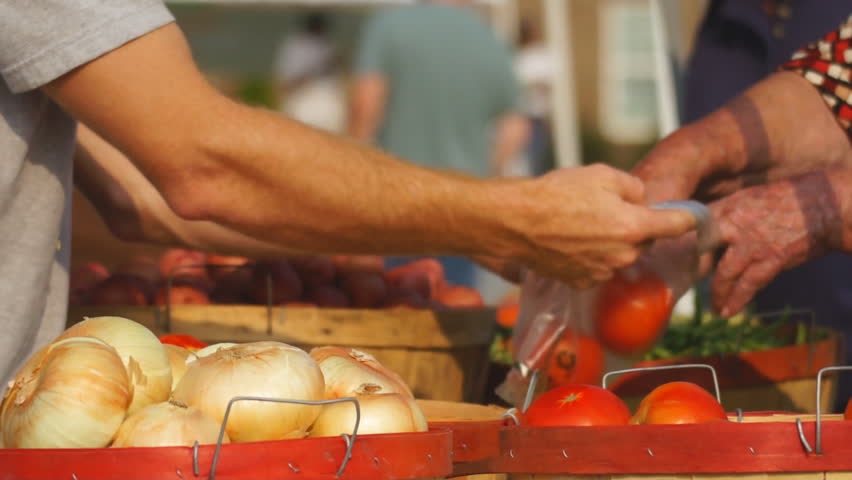 Food being purchased at Farmer's Market