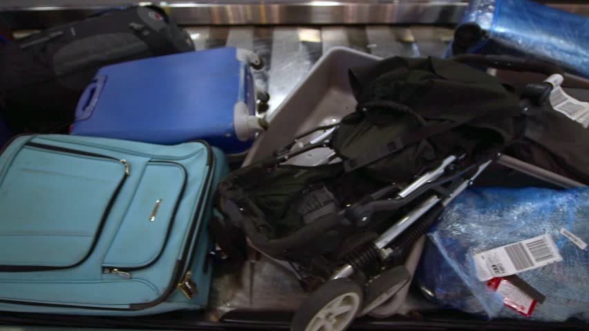 Luggage travels on a conveyor belt at the airport Royalty-Free Stock Footage #13409858
