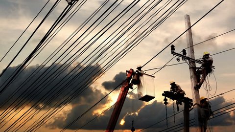 SAMUTPRAKARN, THAILAND - OCTOBER 18, 2015: Electrician are installing high powered electric cables to cope with the increasing power usage of cities on Oct 18,2015 in Samutprakarn, Thailand
