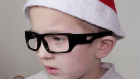 happy boy with glasses/happy boy with glasses and hat of Santa Claus