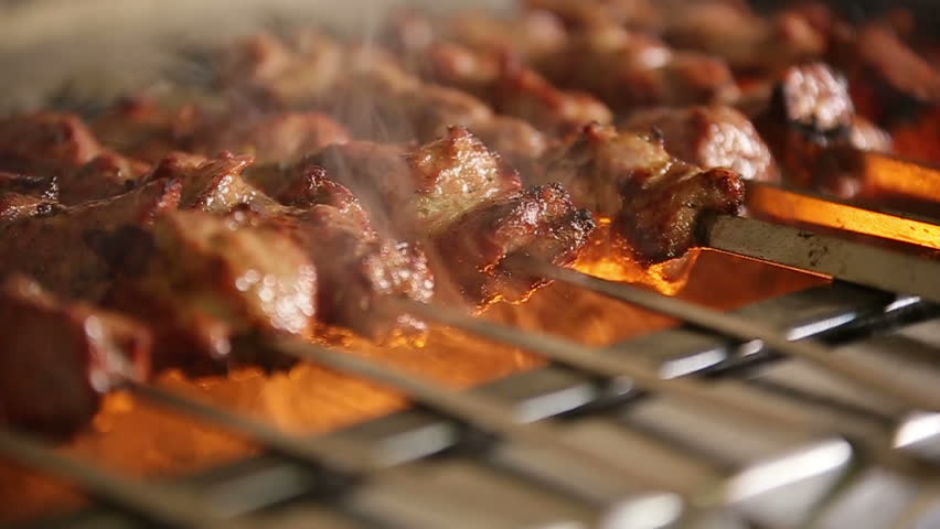 Cook roasts juicy kebab barbecue on the grill slowmotion Royalty-Free Stock Footage #13430738