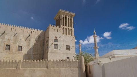 Historic fort at the Museum of Ajman timelapse hyperlapse with blue cloudy sky, United Arab Emirates 4K