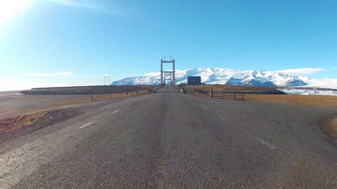 One way steel bridge over river Jokulsarlon Vatnajokull snowy mountains glacier Iceland oncoming traffic
