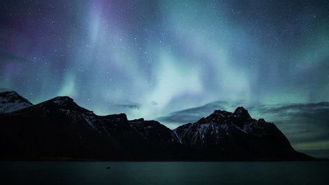 Flashing pulsating aurora borealis Vesturhorn mountains Stokksnes, Iceland 4k