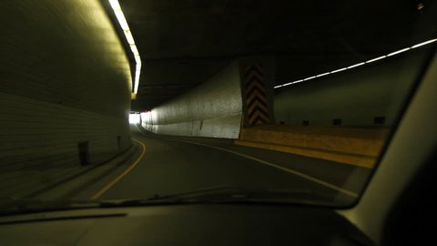 Green tunnel. Driving through a tunnel lit with green light. Montreal, Quebec, Canada.  