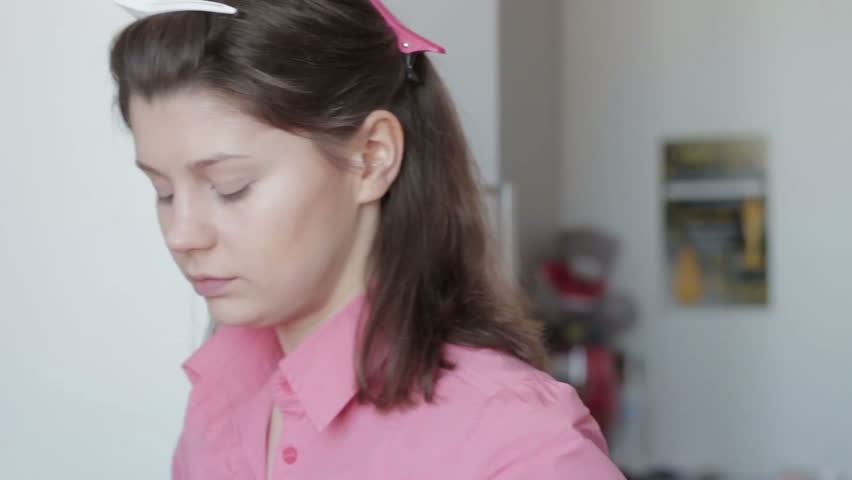 Young girl gets foundation to your face, does makeup.