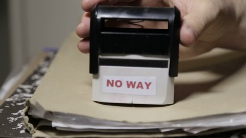 Shot of No way stamp on paper folders