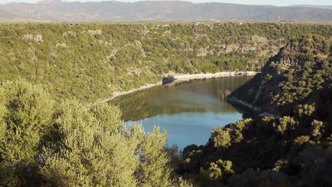 view of Cedrino lake and mountains in Dorgali, Sardinia, Italy