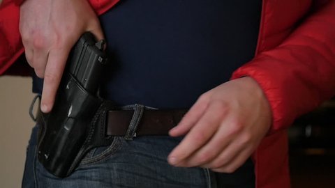 Concealed Gun Drawn From Holster Under Coat, Slow Motion