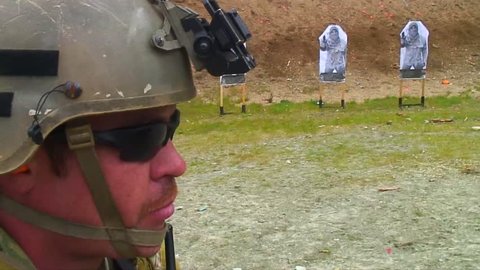 CIRCA 2010s - Soldiers practice firing their weapons on the firing range at Muslim targets.