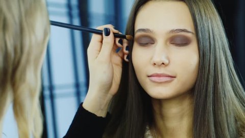 Close-up of a young woman: where to apply makeup