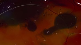 Oil and Ink Swirling Around Texture Background In Slow Motion