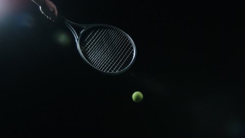 Isolated Tennis ball hit with racquet in slow motion