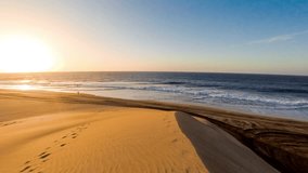 Beautiful sunrise on sand dunes near the beach in Maspalpmas on Gran Canaria island. Time lapse video with motion effect