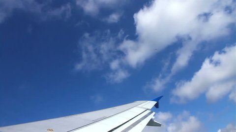 The wing of commerical airplane over cloud 