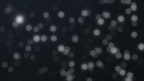 White Particles Looped. Motion background with flying particles, made by loop effect and defocus effect