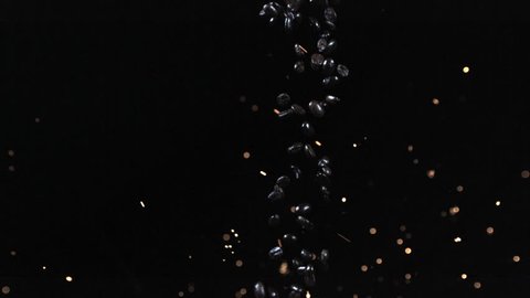Coffee beans and sparks - sparks shot at coffee beans as they fall into a canister - Alpha Matte