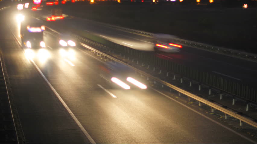 Car Driving on highway at dusk