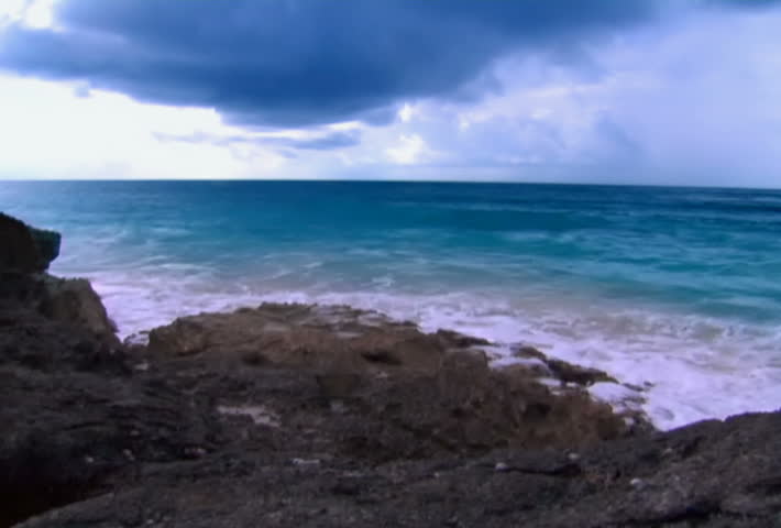 Waves crash upon rocks