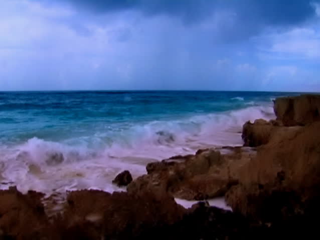 Waves crash upon rocks