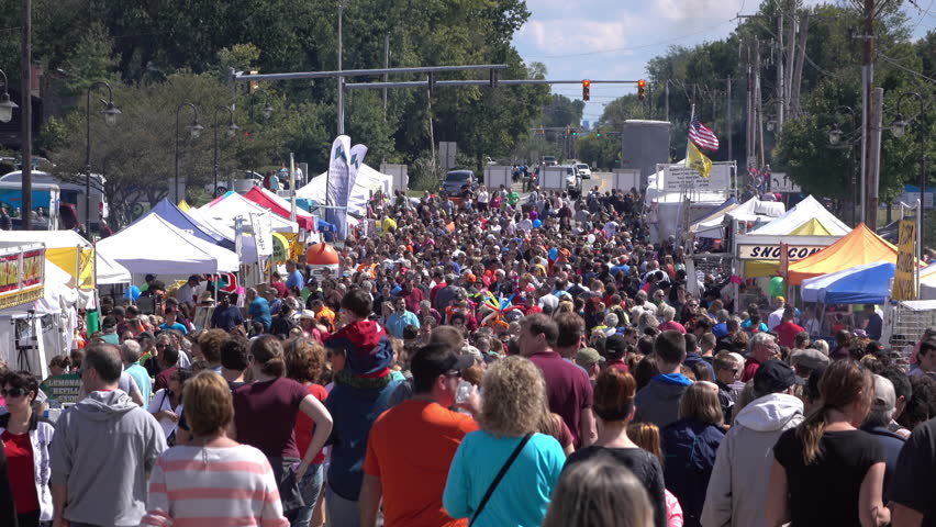 BEAVERCREEK, OHIO - SEPTEMBER 12: Crowds of People at Popcorn Festival visiting local vendors and food stands on September 12, 2015 in Beavercreek, Ohio.