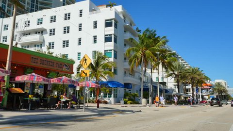 FORT LAUDERDALE - DECEMBER 20: Stock video of Ft. Lauderdale Beach a year round tourist hotspot with shops and dining across the street from the beach December 20, 2015 in Ft. Lauderdale FL