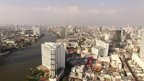 aerial view of bangkok skyscraper beside chaopraya river in heart of thailand capital