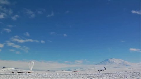 CIRCA 2010s - NASA launches an aerostatic weather balloon from McMurdo Station in Antarctica.