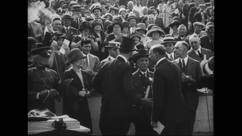 CIRCA 1920s - Calvin Coolidge and other cabinet officials speak before a large crowd and women are given the right to vote in 1919.