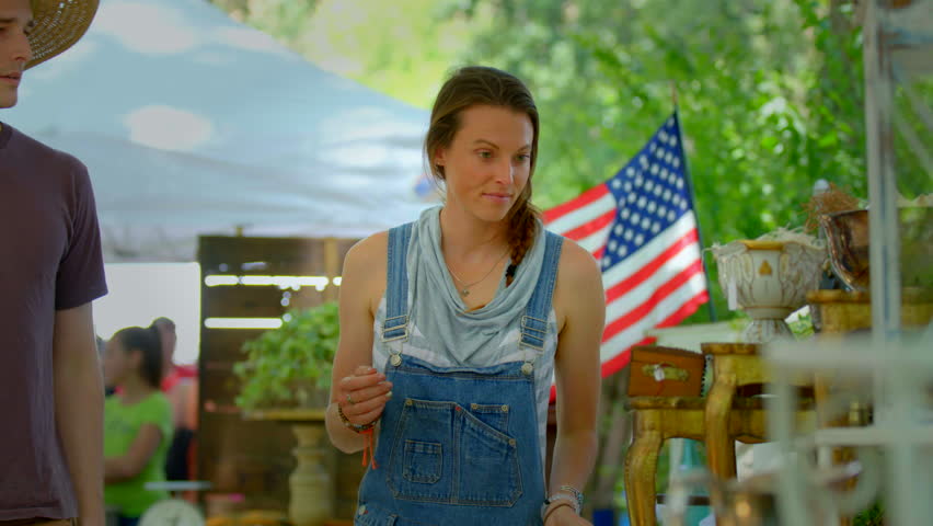 Young couple in love shopping at country flea market