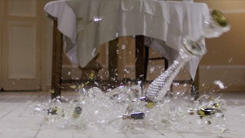 Chandelier falling and breaking on wooden floor . Slow Motion. Shot on RED EPIC Cinema Camera . 