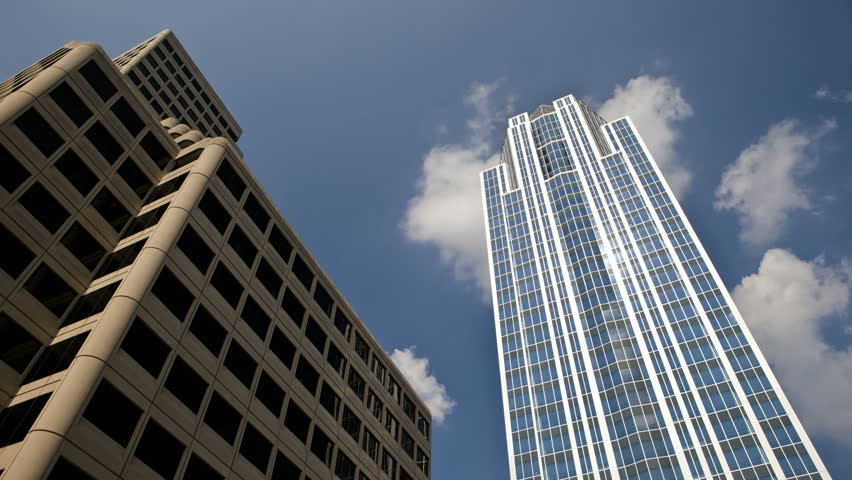 Timelapse of clouds behind a Skyscraper in Cincinnati and blue sky in the