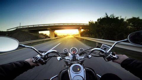 Motorcycle ride pov, road adventure toward sunset, 4k