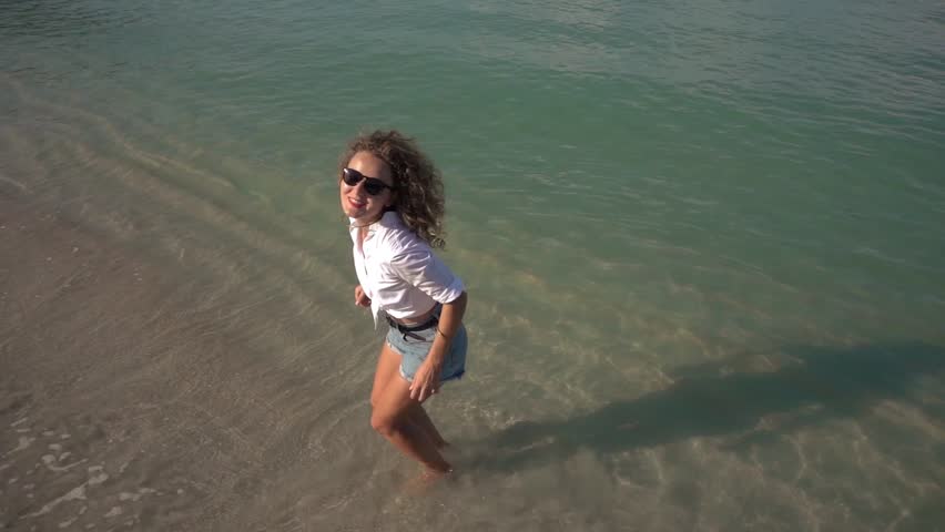 Beautiful Girl Jumping on Beach. Vacation Concept. Slow Motion. 250fps. HD, 1920x1080.   