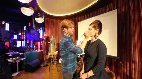 MOSCOW - JAN 18, 2015: Man does make up at Retro Beauty Day in Beverly Hills Diner