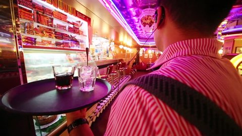 MOSCOW - JAN 18, 2015: Back of waiter going in Beverly Hills Diner - network of stylized American restaurants in Moscow