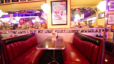 MOSCOW - JAN 18, 2015: Tables with cinema decoration in Beverly Hills Diner - network of stylized American restaurants in Moscow
