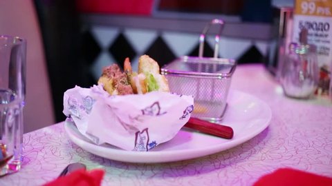 MOSCOW - JAN 18, 2015: Hamburger in Beverly Hills Diner - network of stylized American restaurants in Moscow