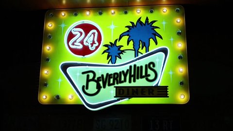 MOSCOW - JAN 18, 2015: Beverly Hills Diner illuminated signboard - network of stylized American restaurants in Moscow