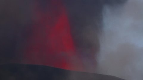 Volcano eruption. Mount Etna erupting from the crater Voragine
