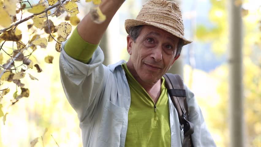 baby boomer observing and touching nature