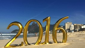 Golden 2016 message standing on the smooth sand of Ipanema Beach in Rio de Janeiro, Brazil