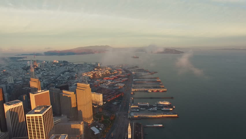 4K Aerial drone shot San Francisco downtown financial building clouds sunrise