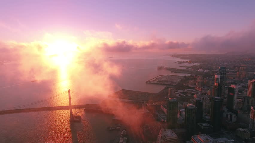 4K Aerial drone shot San Francisco sunrise bay bridge clouds forward