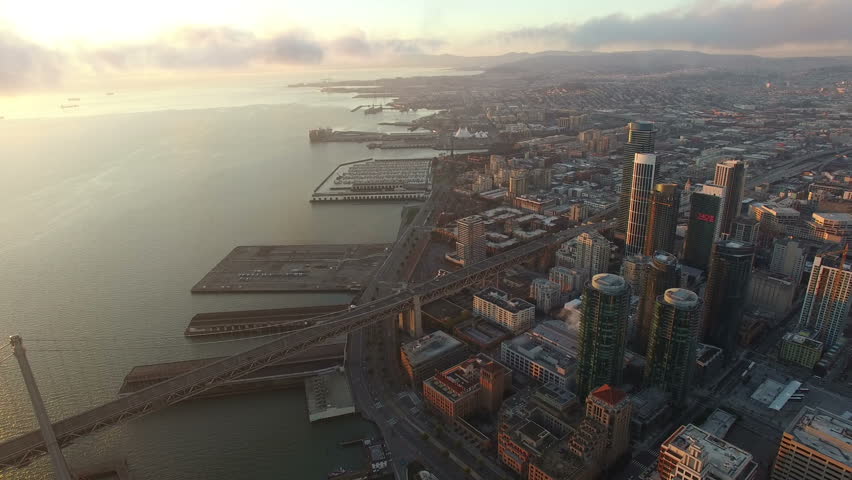 4K Aerial drone shot San Francisco forward building bay bridge clouds