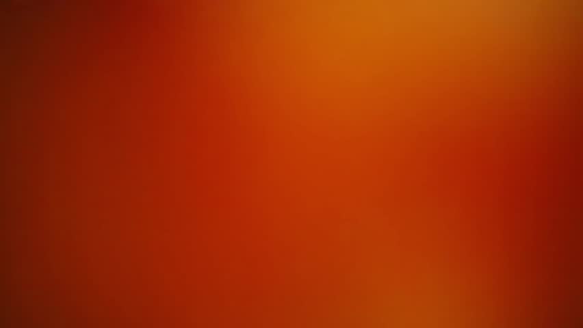 Girl lying on the floor with a bowling ball and a boy throwing a bowling ball