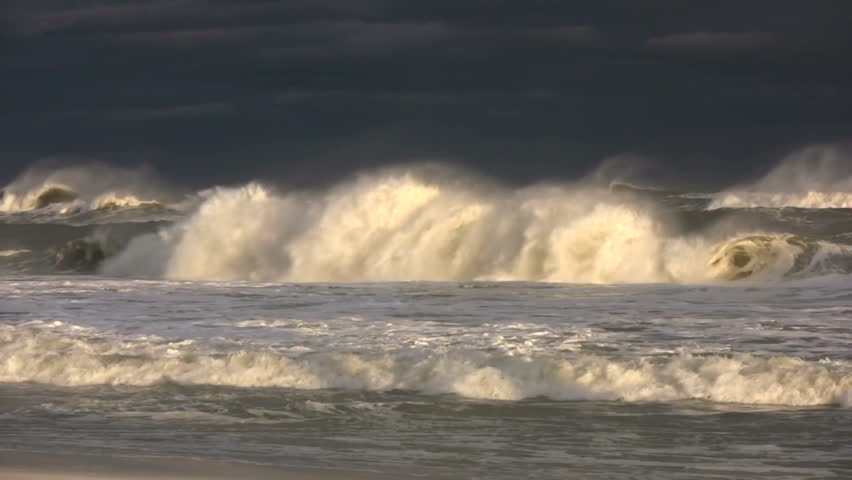 Waves generated by tropical storm winds in the Gulf of Mexico crash on the beach in the gulf coast of Florida.