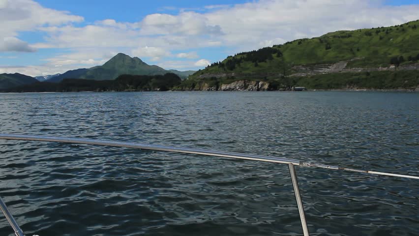 Boat cruises along beautiful Kodiak Island, Alaska coastline. 1080p
