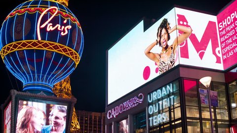 4K Las Vegas Strip Time Lapse: Bright Lights, Neon Signs, and Digital Billboards announce you have arrived at the Miracle Mile in Planet Hollywood with luxury dining, shopping, and sexy entertainment 