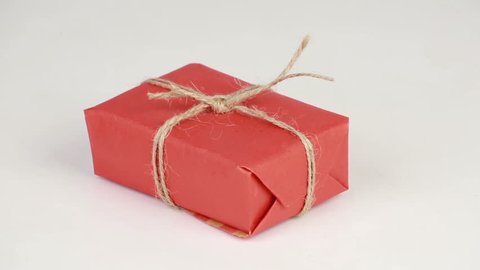 Gift box covered with red wrapping paper
